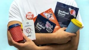 person holding multiple branded items